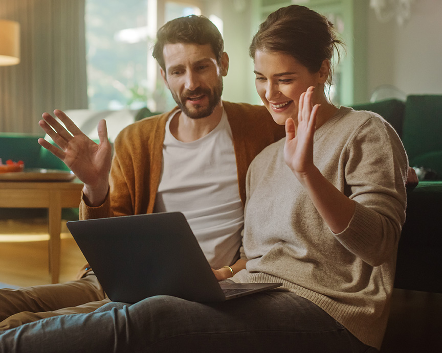 Couple on couch saying hello to Jodi Lerner before their online couples therapy session