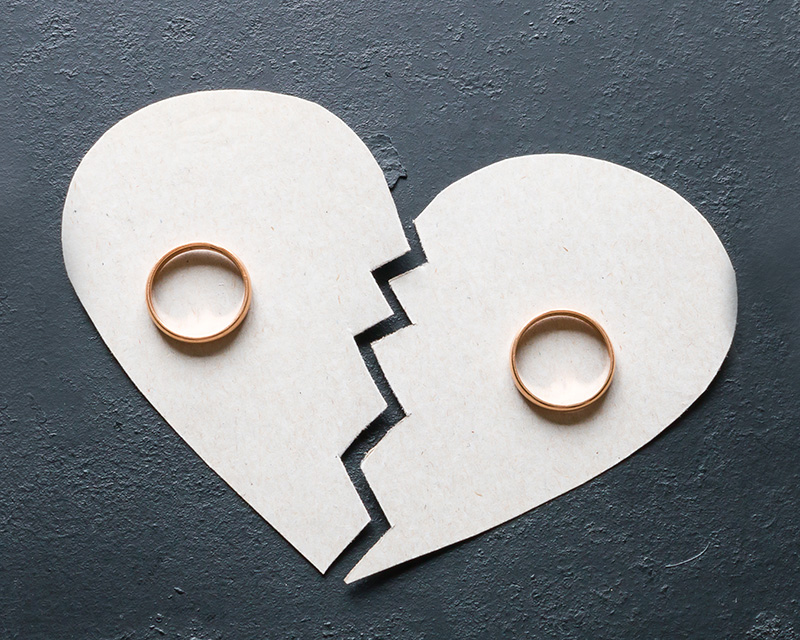 Paper Cut out of couple and broken heart. Discernment counseling can help you decide the best path forward for your relationship