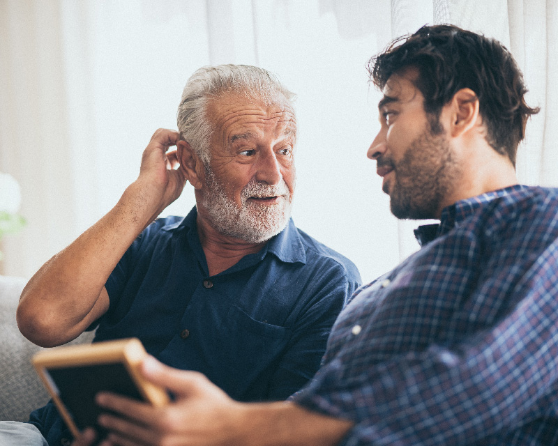 Father and son talking together after family therapy