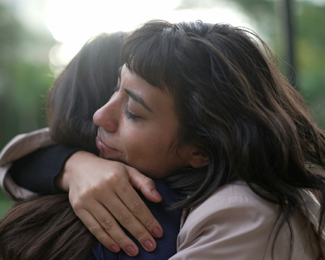 Daughter hugging her mother after family therapy in New York